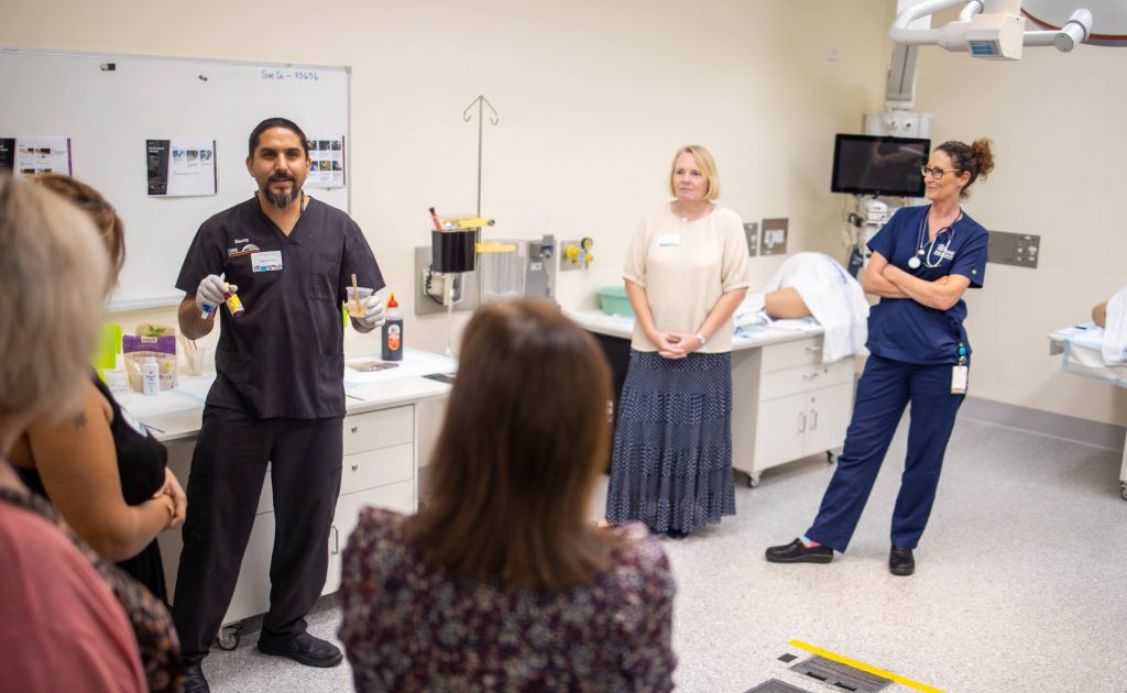 Georg Auer (in black scrubs, left) demonstrates how we create different kinds of moulage for clinical scenarios.